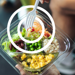 Closeup of a fork in a healthy salad
