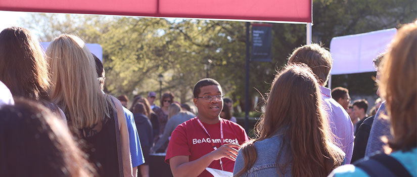 UofSC student interacting with families at an admissions event