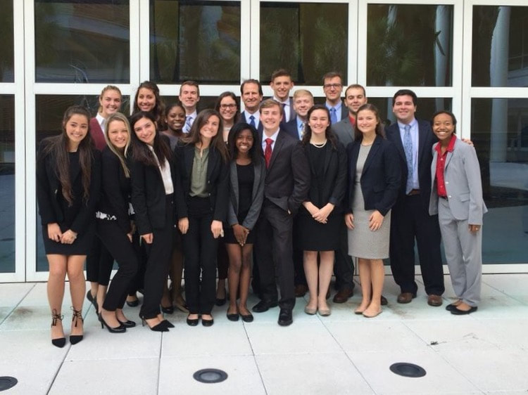 group of delta sigma pi business fraternity students gathered together