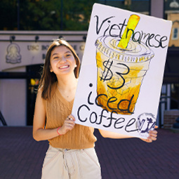 student holding a sign