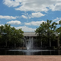 Exterior of Thomas Cooper Library and fountain on sunny day