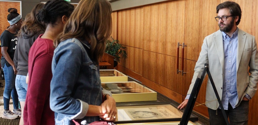 student looking at Great Gatsby exhibit