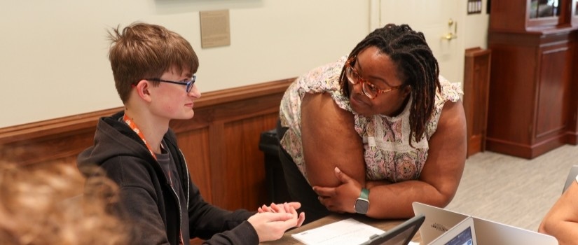 Librarian helping student.