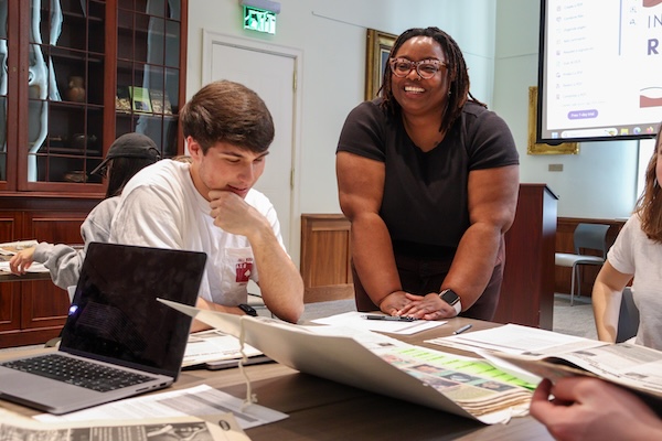 Librarian helping student