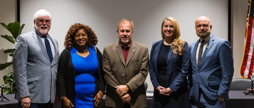 Posed photo of the 2022 Discover UofSC keynote panel showing, from left to right, moderator Dr. Augie Grant, and panelists Dr. Gloria Boutte, Dr. Tim Mousseau, Dr. Melissa Nolan and Dr. Mark Smith.