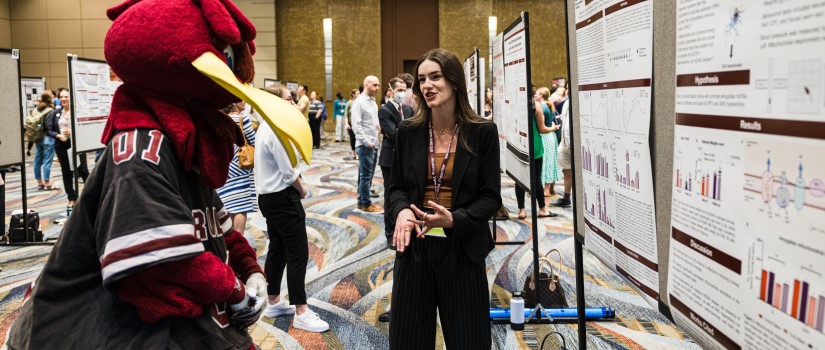 A graduate student presenter tells Cocky about her research project at Discover UofSC 2022 on Friday, April 22 at the Columbia Metropolitan Convention Center.