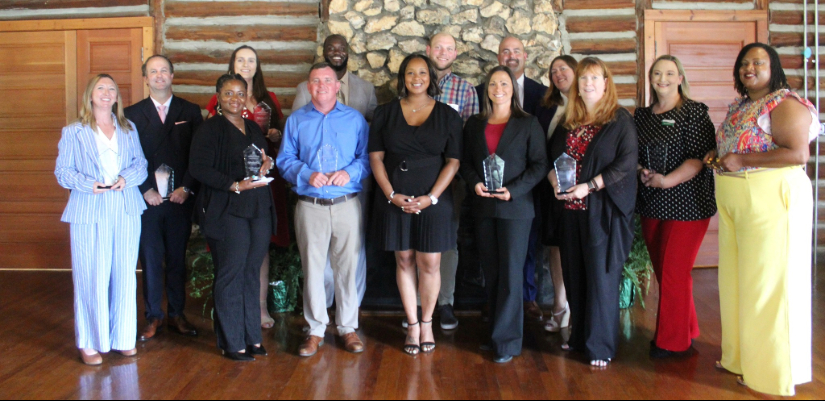 A group photo of the Leadership Class of 2026 holding their awards.