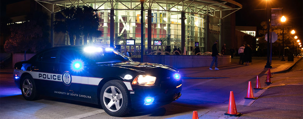 UofSC police car in front of Colonial Life Arena