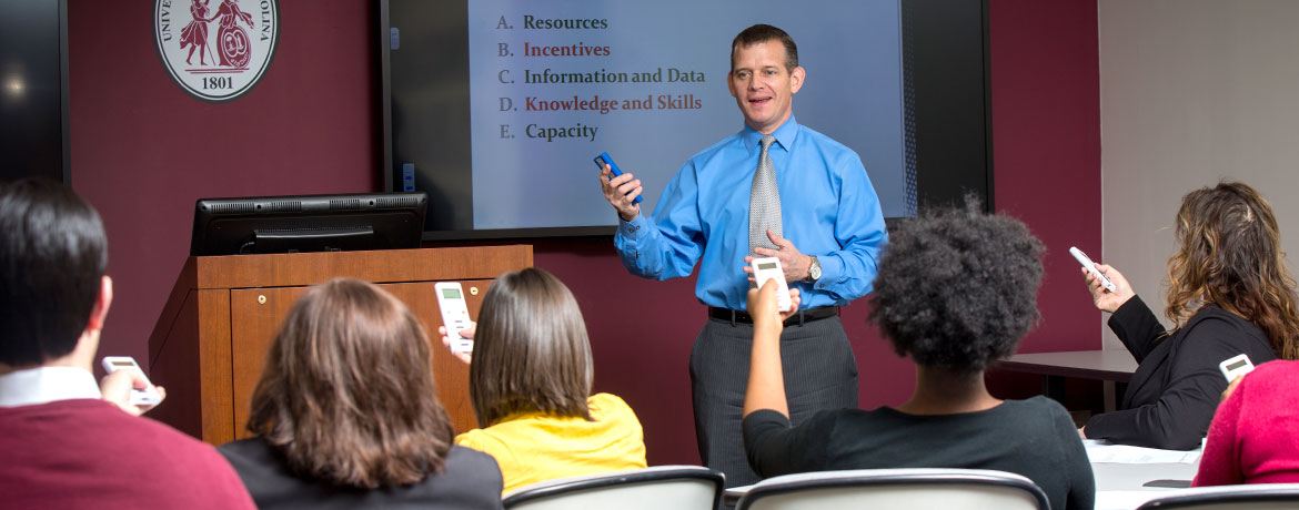 man giving presentation in front of a group