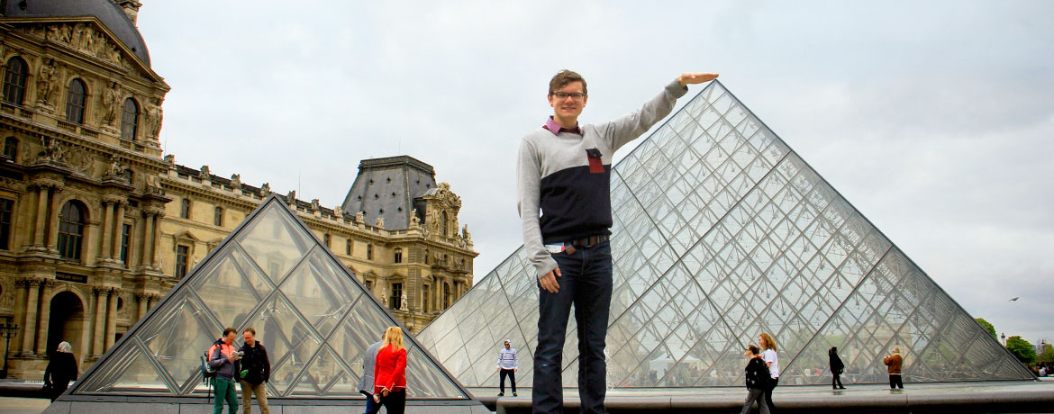student posing outside the Louvre