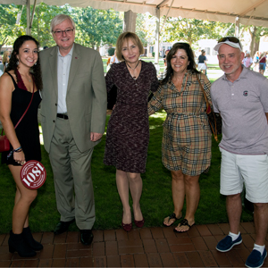a student and her parents stand with President Michael Amiridis and first lady Ero Aggelopoulou Amiridis at family weekend event