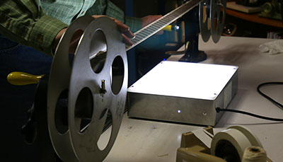 Film strip stretched across a light box. 