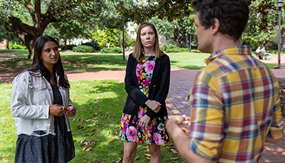 Three students talking on the horseshoe at USC.