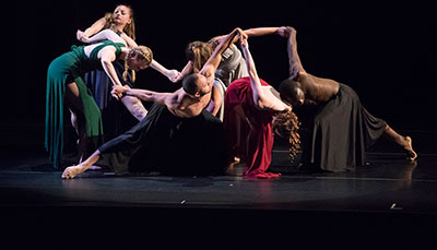Group of dancers on stage during a performance. 