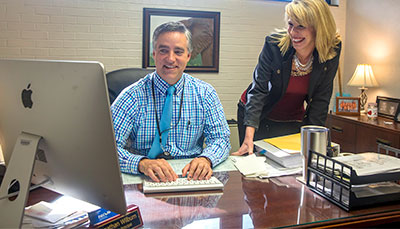 Two education administrators working together in the school office.
