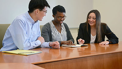 Group of students working together at a table.