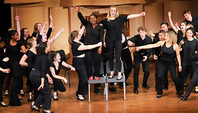 Musical theatre performers on a stage