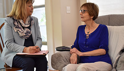 Two people sitting together in a counseling session.