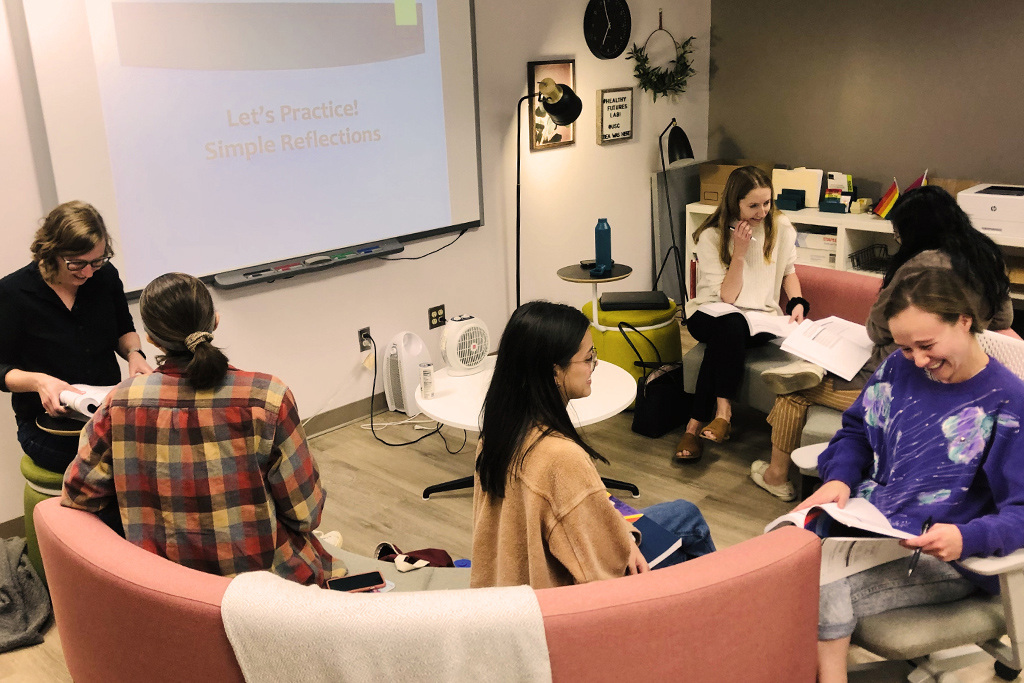 Students in the psychology department work together in pairs in a cozy space.