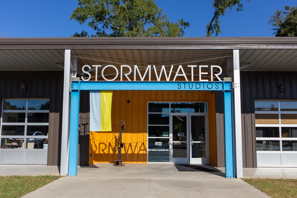 Stormwater Studios' front entrance shows the studio name in large, steel letters above a front door.
