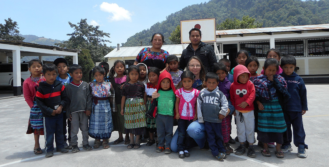 Professor Reynolds in Guatemala with preschoolers