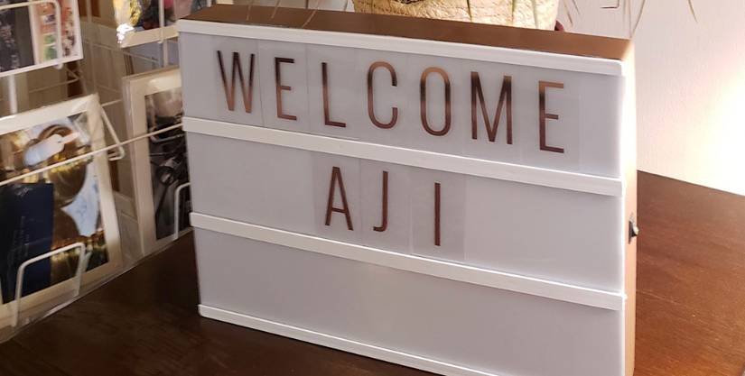 welcome AJI sign