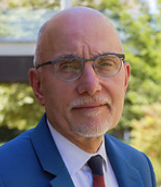Len Abbeduto, a White man with grey facial hair looks at the camera.