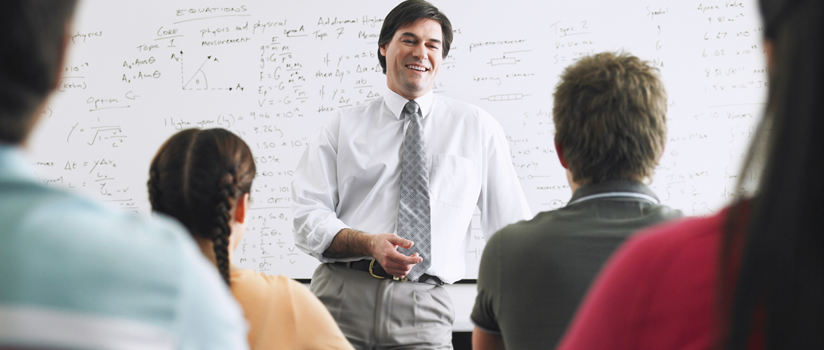 Professor standing in front of class. 