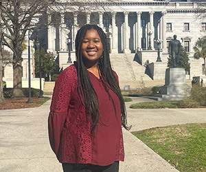 woman smiling at state house