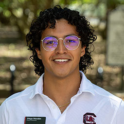 Diego wearing glasses and a gamecock polo shirt.