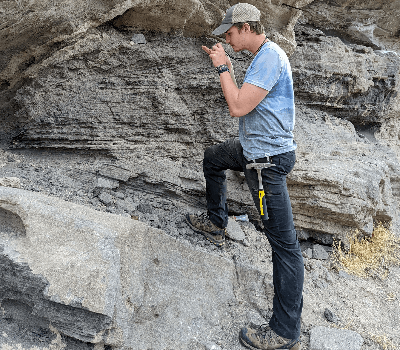 Blake taking photos of sediment