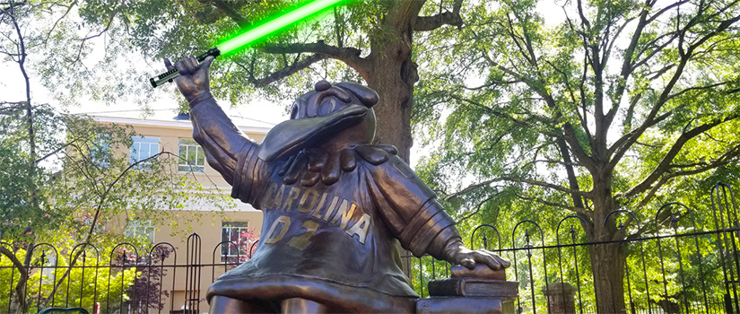 Cocky statue with light saber