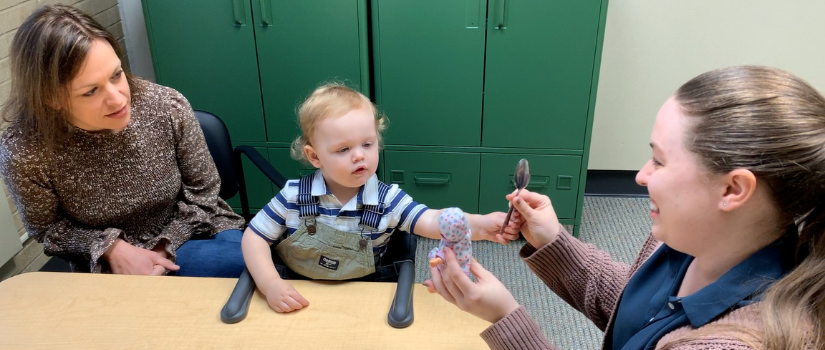 Young boy with two female therapists