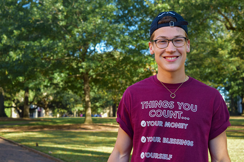 David Olds. Wearing a T-shirt that says "Things you count: Your money, your blessings, yourself"