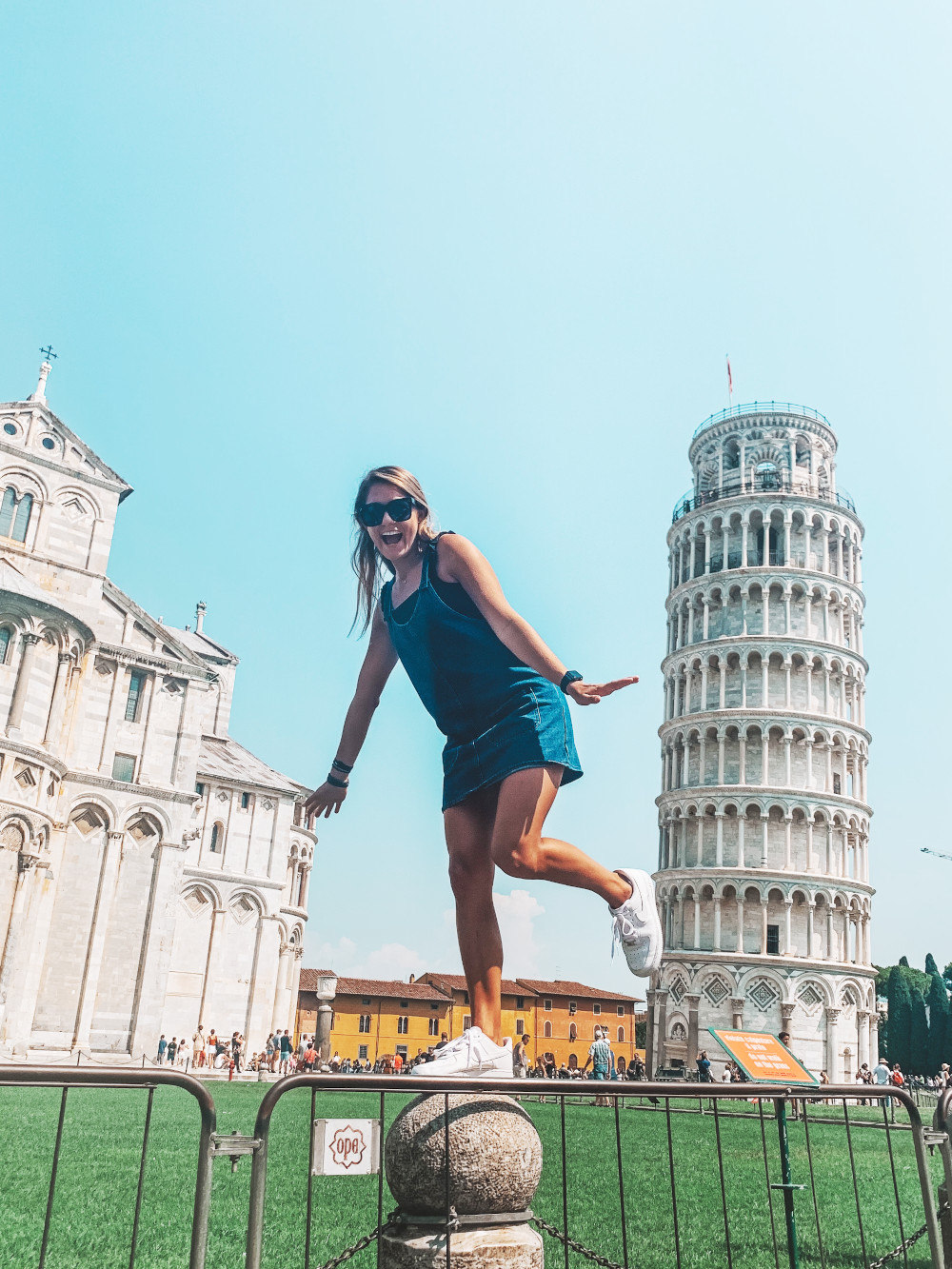 Lilly Kays balances near the Leaning Tower of Pisa