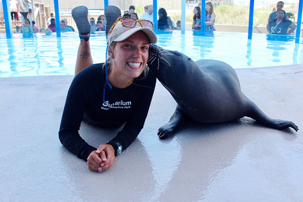 Dani Ramsey with a seal at the Gulfarium