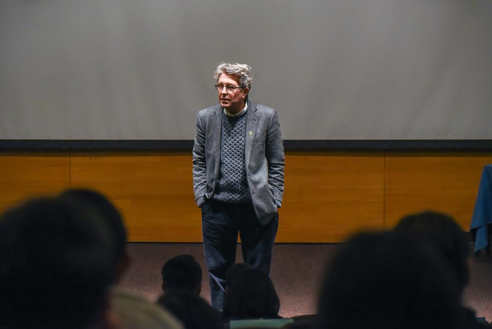 Professor speaking in front of a classroom