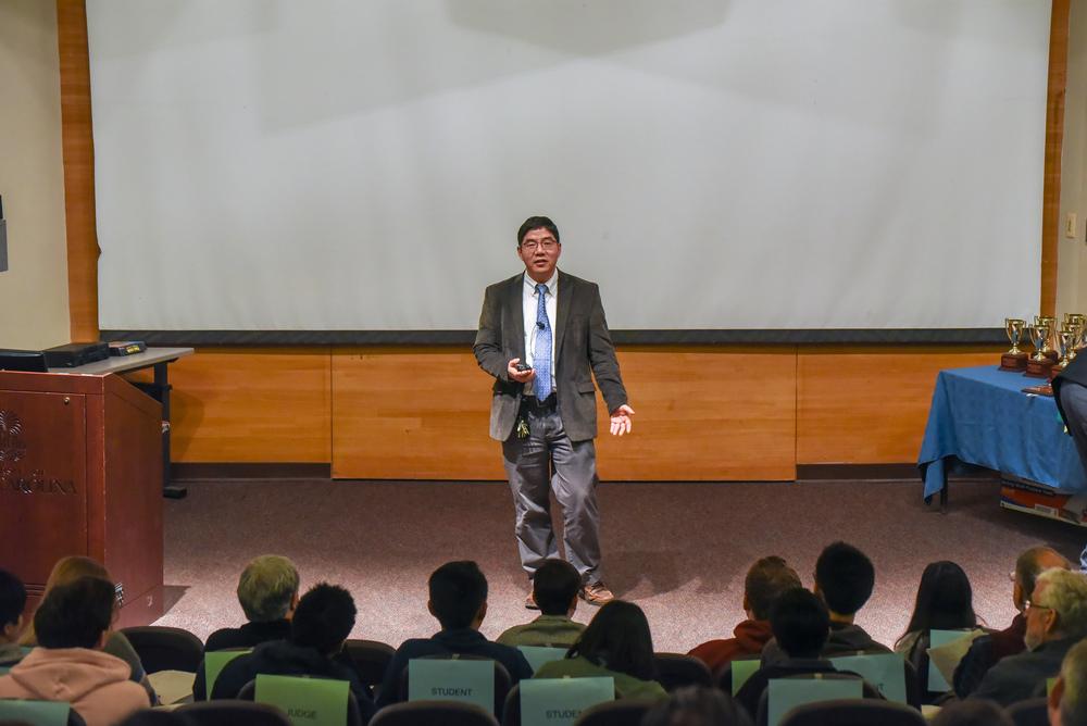 Professor speaking in front of a classroom