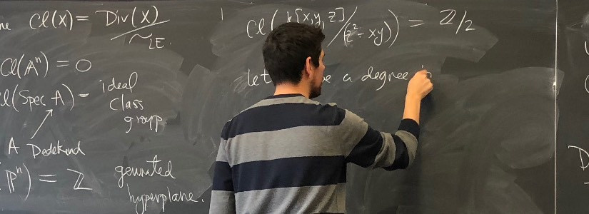 Mathematician at a blackboard