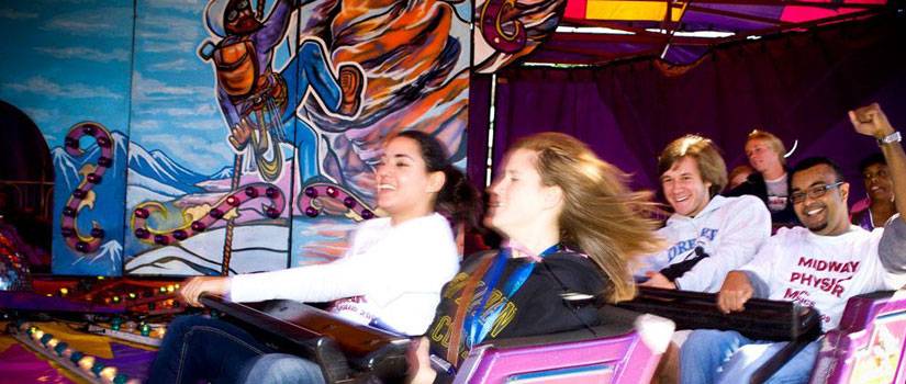 Students enjoy a roller coaster.
