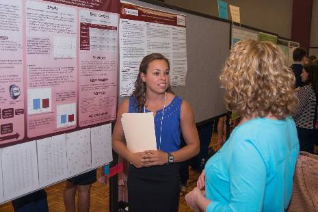Student presenting poster at Discovery Day