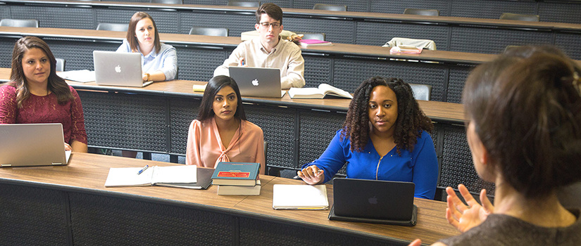 grad students in a class listening to professor