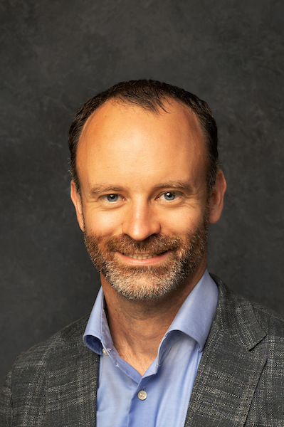 man smiling with suit on