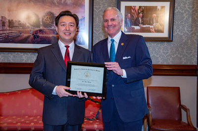 Hui Wang receiving the 2019 Governor's Young Scientist Award for Excellence in Scientific Research by South Carolina Governor Henry McMaster at the Statehouse.