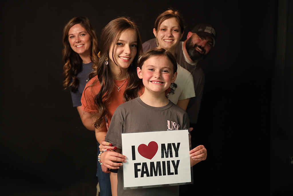 Families visited the visual communications studio for family photos.