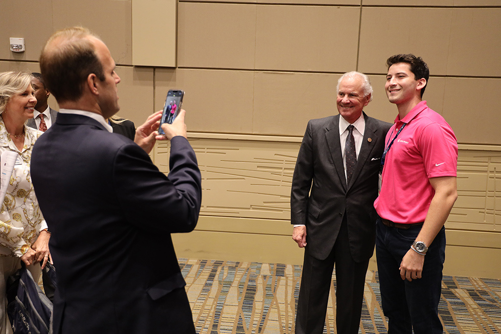 Junior Aidan Silverman takes a photo with Gov. Henry McMaster at the SC Decoded conference.