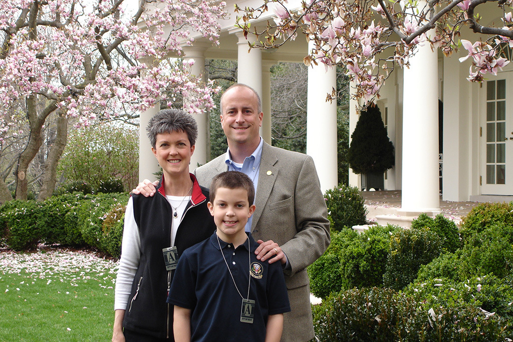 Sandy, Connor (HRSM ’18) and Jack Claypoole pose for a family portrait in the Rose Garden at the White House in 2007.