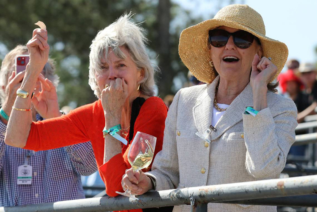 Harriet Dubose left, and Mary Elizabeth Boykin enjoy the suspense of the 3rd race of the Carolina Cup. Photo by BARLOW COOPER