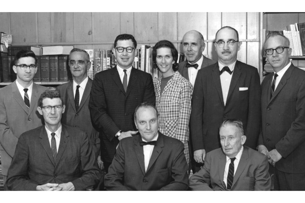 Faculty in 1965 (seated, l to r) Dr. Bill Winter, Dr. Albert Scroggins and George Buchanan. (back row, l to r) William F. Watson, who was also city editor of The Columbia Record; visiting Professor George E. Simmons; Dr. George Crutchfield, Lee Skidmore (later Wenthe), Jack McGrail, Dr. Richard Uray, and Dr. Reid Montgomery.
