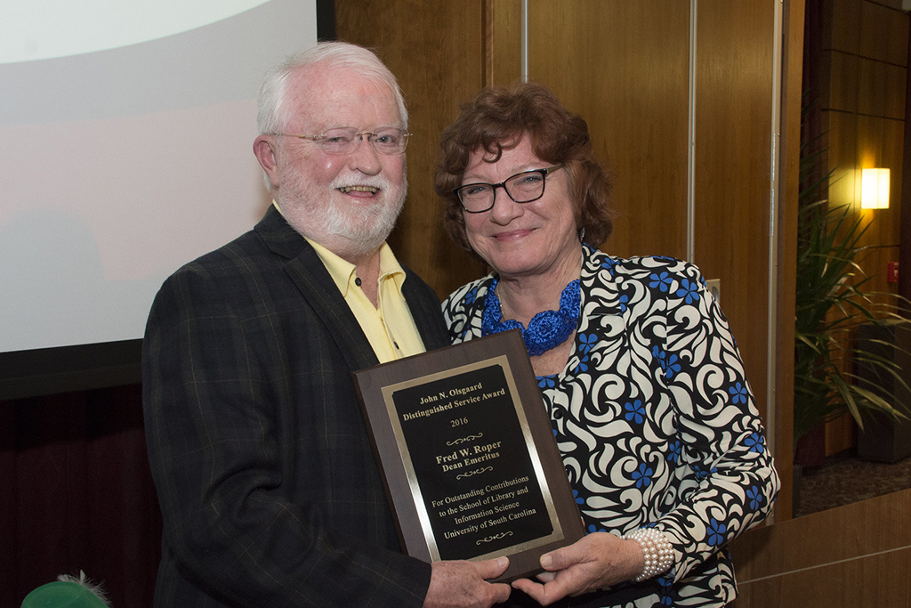 Fred Roper was awarded the John N. Olsgaard Distinguished Service Award in 2016. Pictured with Samantha Hastings, director of the school at that time.